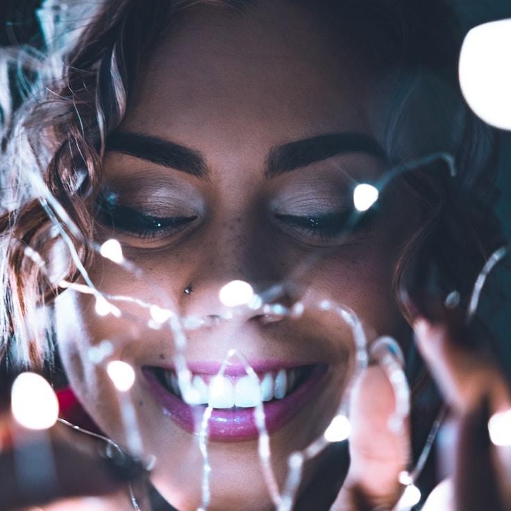 Anya Patel, Lead Design Curator at HavenStoneValley, reviewing corporate floral arrangements